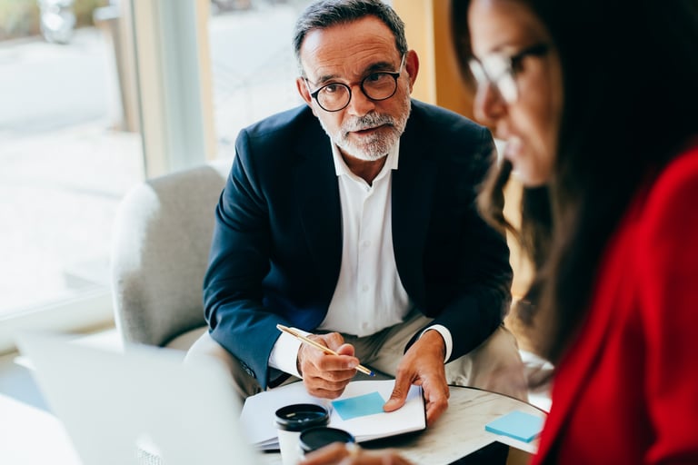 Policy briefing session with professionals reviewing housing data